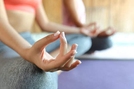 Close op of a hand of a woman doing yoga in spaの写真素材