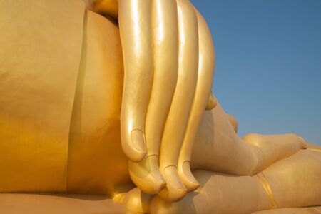 Golden finger of big buddha at thai templeの写真素材