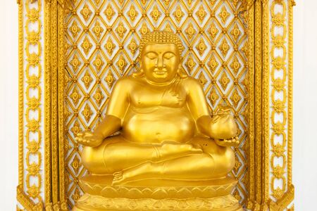 Golden fat buddha statue in thai templeの写真素材