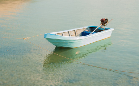 The blue ship floating on the blue seaの写真素材
