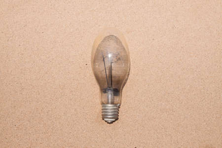 The lamp on the grain of sand backgroundの写真素材