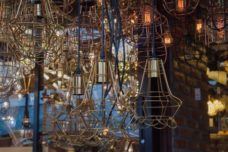 The background of lighting from many brass chandelier
