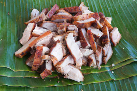 The background of roasted pork on banana leafの写真素材