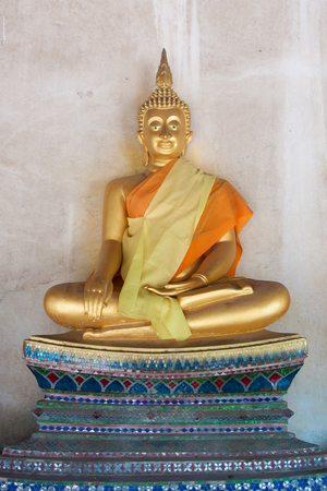 Golden big buddha statue in thai templeの写真素材