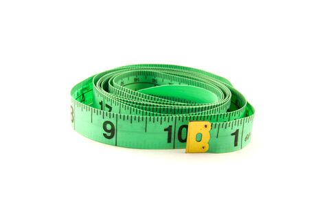 The green measuring tape on the white backgroundの写真素材