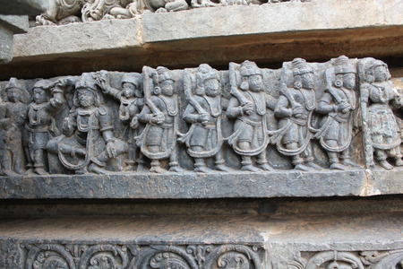 Hoysaleswara Temple Wall carving of fully armored warriors marchingのeditorial素材
