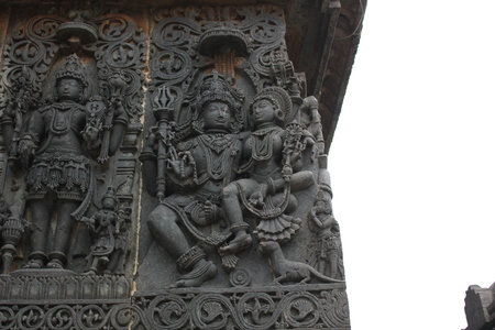 Hoysaleshwara temple wall carving of lord shiva and parvati below her vahana mongooseのeditorial素材