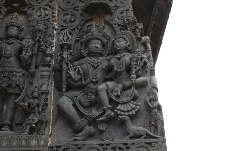 Hoysaleshwara temple wall carving of lord shiva and parvati with her vahana mongooseのeditorial素材