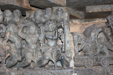 Hoysaleswara Temple wall carving of warrior using telescope in the war fieldの写真素材