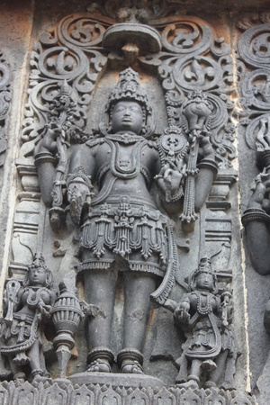 Hoysaleswara Temple wall carving of hindu male godの写真素材