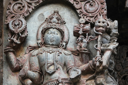 Hoysaleswara Temple outside wall carved with sculpture of Mansana Bhairava (lord shiva)の写真素材