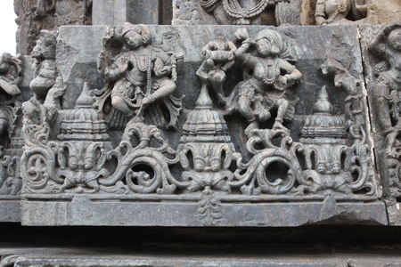 Wall carving of dancers at hoysaleswara templeの写真素材