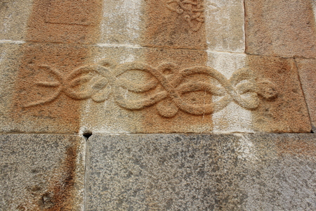 carving of Twining serpents (snakes) on the wall of Gomateshwara temple, Vindhyagiri, Shravanbelgolaの写真素材