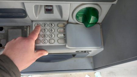 person withdrawing money at ATM in Argentinaの写真素材
