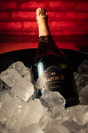 Bottle of "Baron B" brand champagne on ice.のeditorial素材