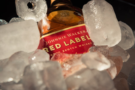 Bottle of "Red Label" brand whiskey on ice.のeditorial素材