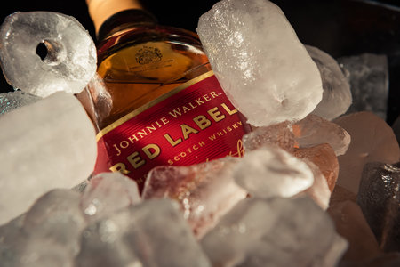 Bottle of "Red Label" brand whiskey on ice.のeditorial素材