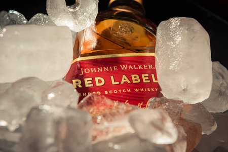 Bottle of "Red Label" brand whiskey on ice.のeditorial素材