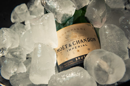 Bottle of champagne brand Moet y Chandon Extra Brut on ice.