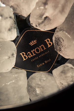 Bottle of "Baron B" brand champagne on ice.のeditorial素材