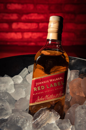 Bottle of "Red Label" brand whiskey on ice.のeditorial素材