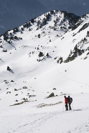 Hikers in the snow mountain in winterの写真素材