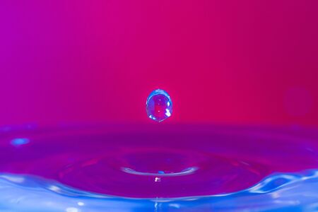 A drop of water create a stunning random water effect.の写真素材