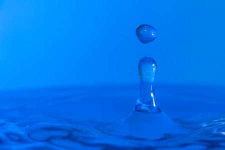 A drop of water create a stunning random water effect.の写真素材