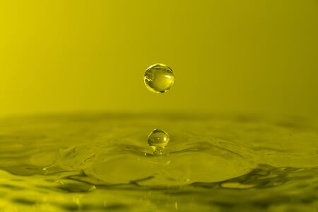 A drop of water create a stunning random water effect.の写真素材