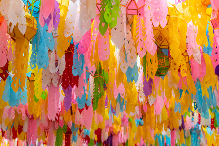 Colorful lanterns hung beautifully in Hariphunchai temple during lantern festivalの写真素材