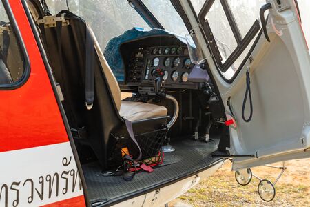PHETCHABUN, THAILAND - DEC.25, 2018 : Airbus Eurocopter AS350 helicopter door open showing pilot seat, control panel and control stickのeditorial素材