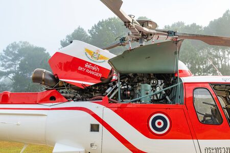 PHETCHABUN, THAILAND - DEC.25, 2018 : Airbus Eurocopter AS350 helicopter of Ministry of Natural Resources and Environment of Thailand at Tung Salaeng Luang National Park with engine cowling open for pre flight checkのeditorial素材