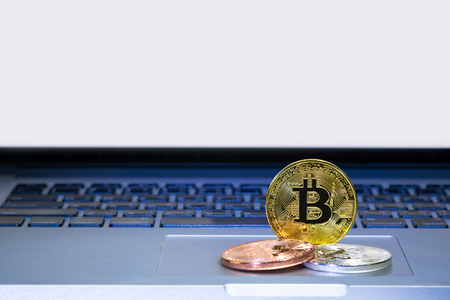 Bitcoin coins on laptop computer track padの写真素材