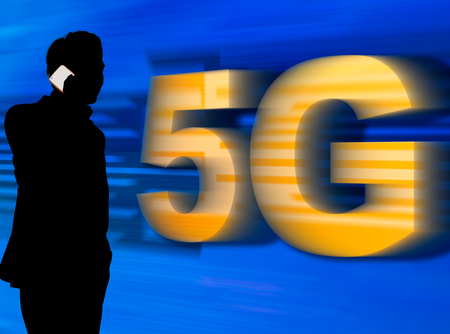 A man in silhouette talking on mobile phone with 5G network - 5G conceptualの写真素材