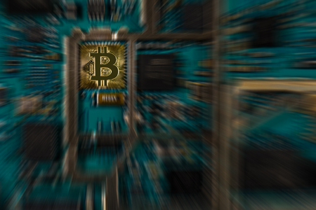 Bitcoin digital currency on electronic print circuit board with zooming effect - conceptualの写真素材