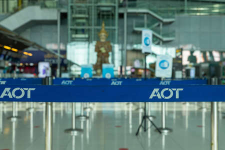 Suvarnabhumi Airport, Bangkok, Thailand - April 4, 2020 : Blue belt from queue pole barrier stands with AOT logoのeditorial素材