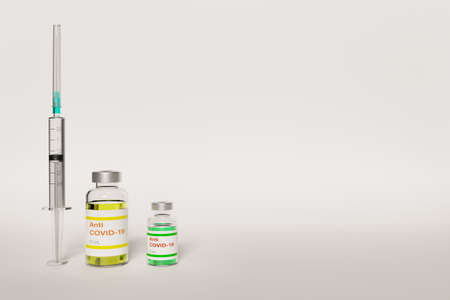Anti COVID-19 vaccine vial and a syringe on white background