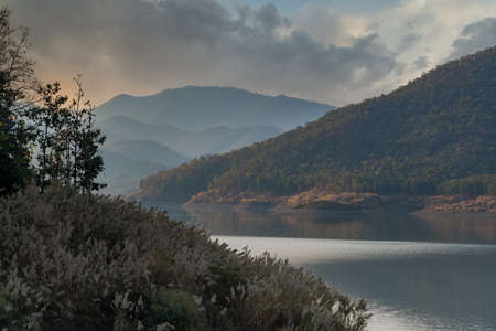 Complexity of mountain landscape and reservoir  with beautiful cloudy sky in backgroundの写真素材