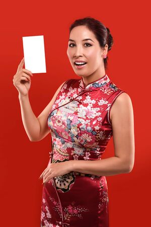 Studio shot Beautiful sexy Asian woman cerebrate Lunar New year in Chinese styleの写真素材