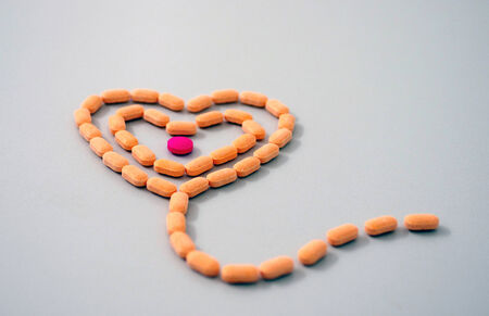 one medicine  in central of double heart の写真素材