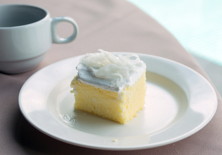 cream cake and cup of coffeeの写真素材
