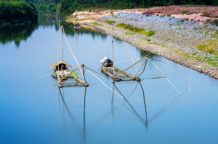 fishing bamboo raft on riverの写真素材
