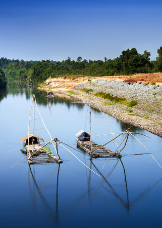 fishing bamboo raft on riverの写真素材
