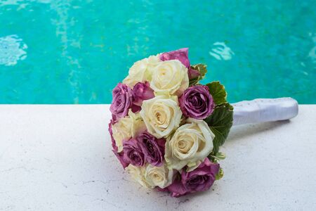 wedding bouquet of White and purple rosesの写真素材