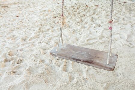 A swing on the sand beachの写真素材