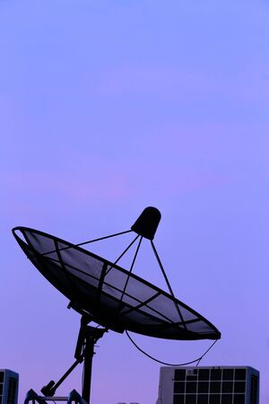 Silhouette Satellite on twilight ,backgroundの写真素材