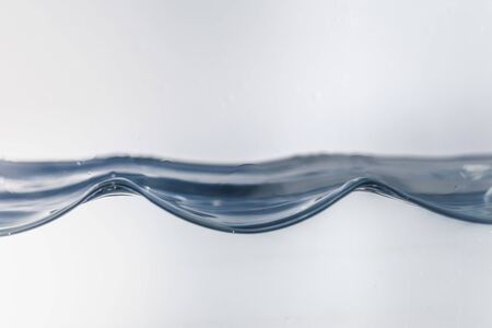 Nice abstract blue water splash on white backgroundの写真素材