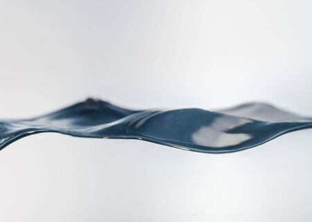 Nice abstract blue water splash on white backgroundの写真素材