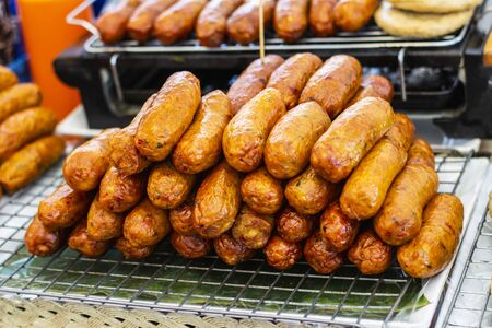 Fried sausages on a plateの写真素材
