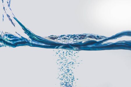 Water splash with bubbles of air, isolated on the white background.の写真素材